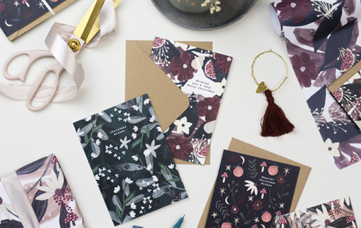A collection of floral-themed cards and envelopes showcasing a diverse range of beautiful designs.